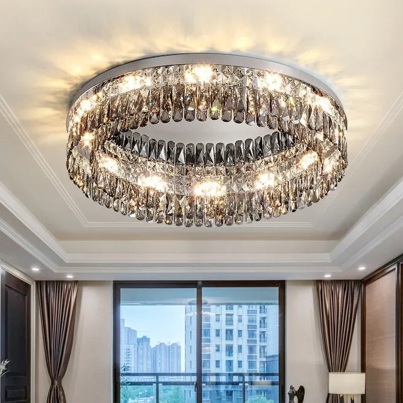 The Maison Ornate Elegant Modern Crystal Bedroom Chandelier features LED lighting and sparkling crystal accents.