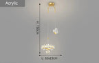 Maison Ornate Minimalist chandelier with gold mount, crystal ball, acrylic ring, and butterfly ornament.