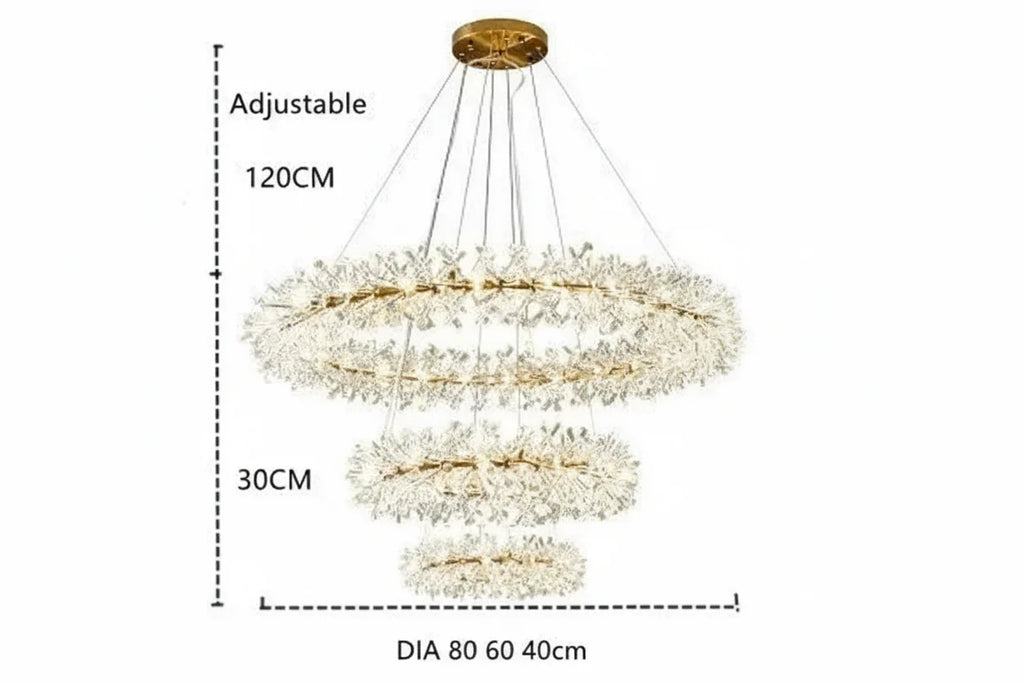 Modern crystal chandelier with three circular LED rings and adjustable cables on a gold base.