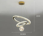 Ornate golden crystal chandelier with dual intertwined LED rings and central starry glass balls.