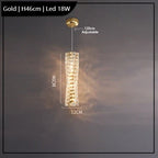 Gold cylindrical chandelier with LED lights, textured design, K9 crystal accents, adjustable suspension.