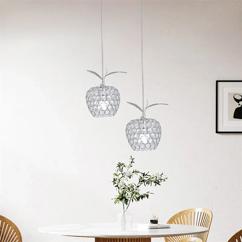 The Maison Ornate Modern Crystal Chandelier features sparkling crystals and a sleek, elegant silhouette.