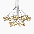Two intertwined gold rings with LED bulb lights form a dramatic, modern crystal chandelier.