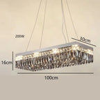Elegant modern crystal LED chandelier with shimmering prisms on rectangular frame, suspended by two wires.