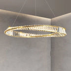 Circular crystal chandelier with twisted design emits a warm golden glow, exuding modern elegance.
