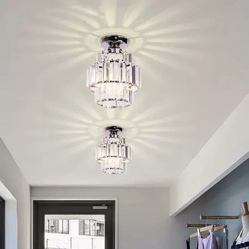 Pair of Maison Ornate K9 Crystal Art Deco Indoor Pendant Lights with decorative pattern projection.
