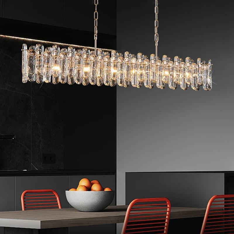 Maison Ornate Golden Crystal chandelier features modern reflective design with elegant, intricate detailing and warm illumination.