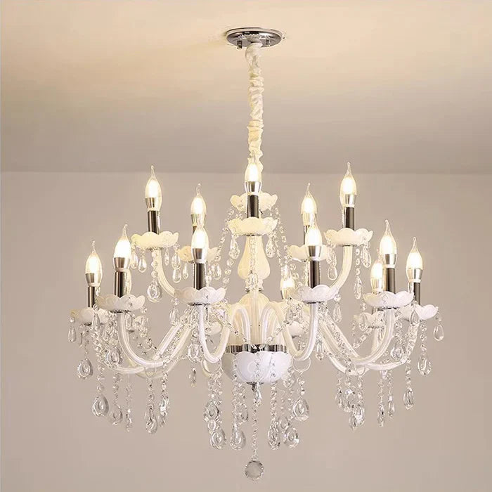 Baroque-style chandelier with twelve candle bulbs, curved glass arms, and cascading crystal accents.