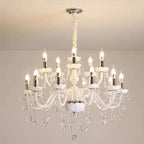 Baroque-style chandelier with twelve candle bulbs, curved glass arms, and cascading crystal accents.