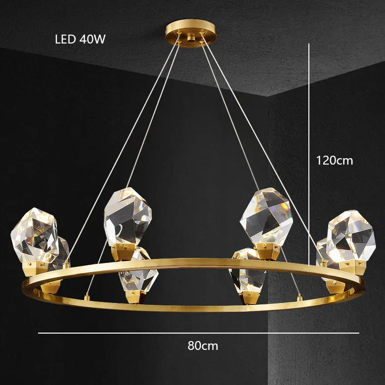 Modern glass crystal chandelier with six faceted LED lights on a brass frame, elegant design.