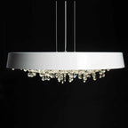 Modern white circular LED chandelier with sparkling crystal accents, suspended by thin wires.