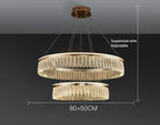 Luxury chandelier with double gold rings, crystal accents, and adjustable wires for modern elegance.