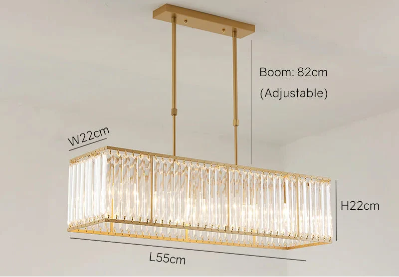 Rectangular gold-accented LED crystal chandelier with vertical crystal rods and adjustable suspension. Modern, elegant design.