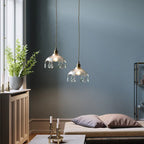 Pair of Maison Ornate Nordic crystal glass chandeliers, elegant cut-glass design, softly glowing overhead.