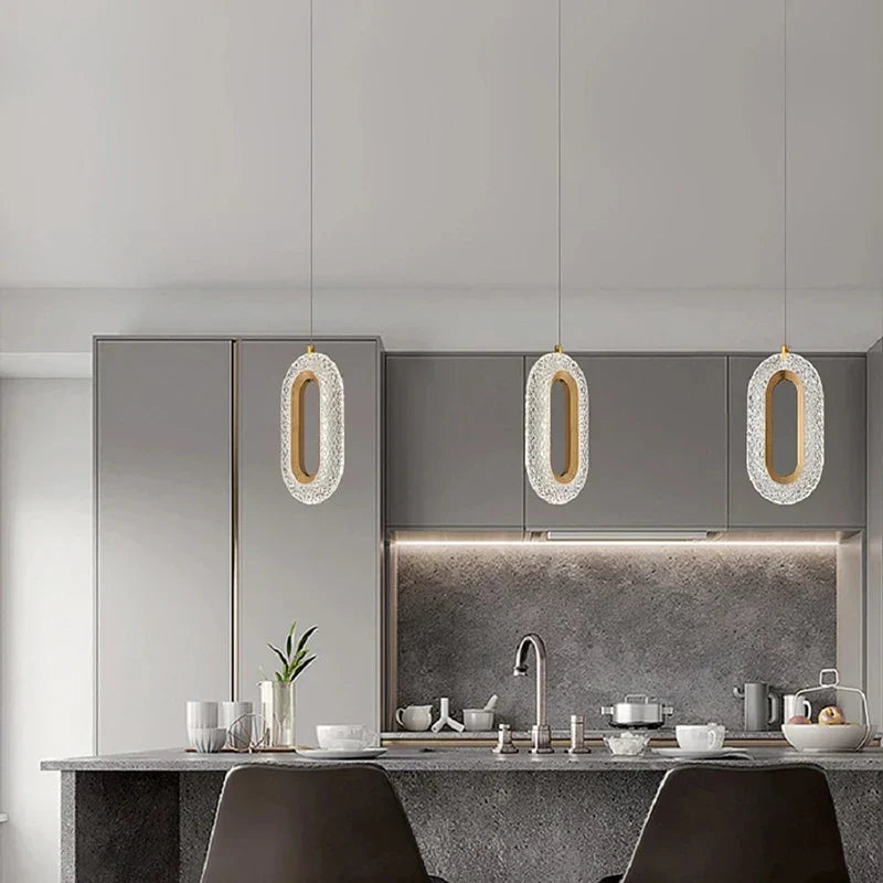Three Art Deco Crystal Chandeliers with gold emerald suspension, elegant and luxurious lighting fixtures.