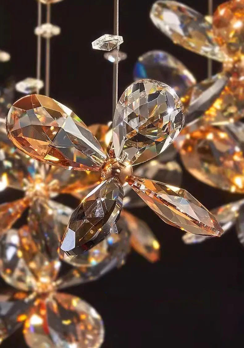 Modern Crystal LED chandelier with faceted crystal petals emitting warm golden and amber light.
