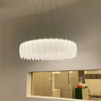 Maison Ornate Crystal Ball Chandelier features decorative feathers and glass, suspended on thin wires.