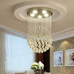 Modern spherical crystal chandelier with spiral hanging glass crystals and polished steel LED mount.
