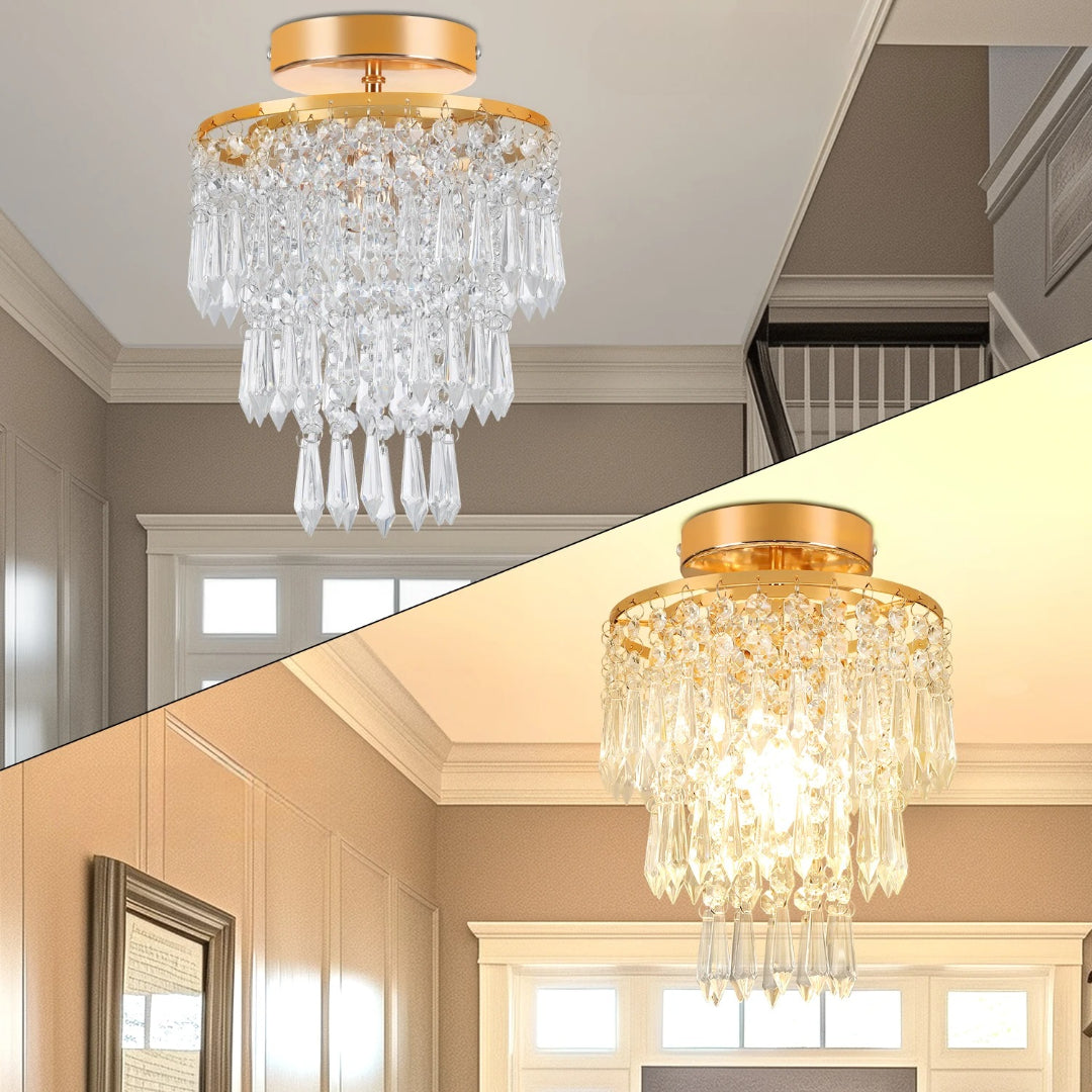 Gold stainless modern crystal Art Deco chandelier with hanging prisms, sparkling clear crystals, warm illuminated glow.