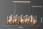 Rectangular gold-accented crystal LED chandelier with visible bulbs, 80cm by 23cm, four adjustable cables.