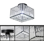 Art Deco crystal chandelier with adjustable lights, black base, clear glass rods in close-up.