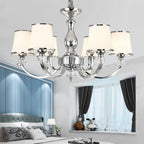 Maison Ornate Luxury Baroque Crystal Chandelier with six white lampshades and ornate detailing.