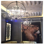 Pair of Maison Ornate American Style Industrial Crystal Birdcage Iron Chandeliers, elegant and intricate.