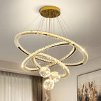 Maison Ornate Golden Crystal Chandelier with three intersecting LED crystal rings and four glowing glass balls.