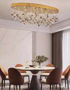Maison Ornate Modern Crystal LED Pendant Light with cascading crystals, elegant gold accents, and sleek modern design.