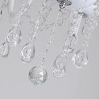 Close-up of Maison Ornate Baroque crystal chandelier droplets and bead strands, reflecting sparkling light.
