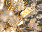 Close-up of modern LED white crystal chandelier with clear acrylic crystals and a sleek design.