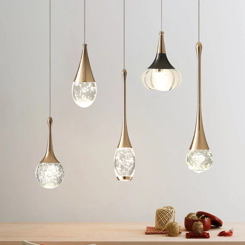 Five Maison Ornate Single Head Luxury Crystal Pendant Lights with gold-toned fixtures and glass bulbs.