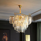 Spiral crystal chandelier with cascading rectangular crystals and gold accents, radiating elegant glamour.