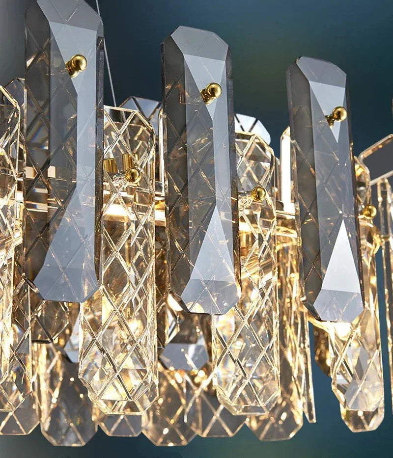 Geometric crystal chandelier with gold accents, featuring LED lights and multifaceted prisms for elegance.