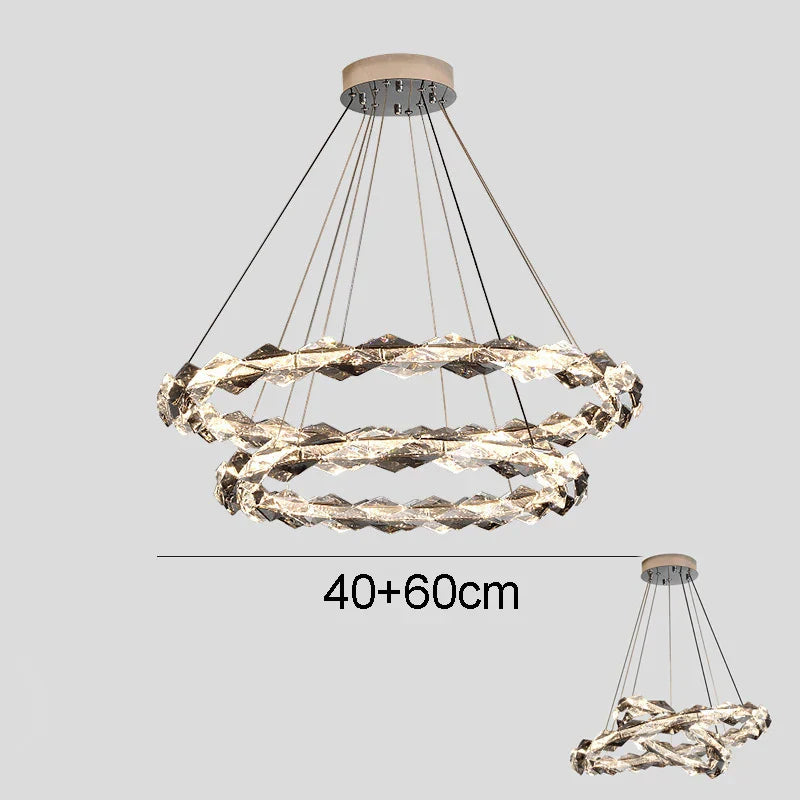 Two intertwined crystal LED rings chandelier, dimmable lighting, suspended from a round metal base.