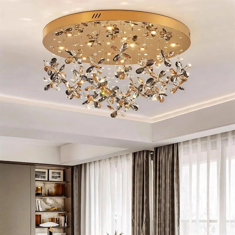 Maison Ornate Modern Crystal LED chandelier features gold accents and crystal butterfly details.