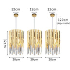 Three gold and silver crystal pendants hang in a row, adjustable cords, modern LED chandelier.