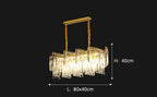 Luxurious spiral chandelier with cascading crystals, gold accents, and dual gold suspension cables, 80×40×40 cm.