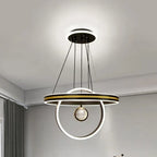 Circular crystal chandelier with LED geometric rings, suspended by black wires from a round ceiling base.