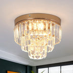 Gold-finished LED chandelier with tiered K9 crystal prisms for a warm, elegant glow.