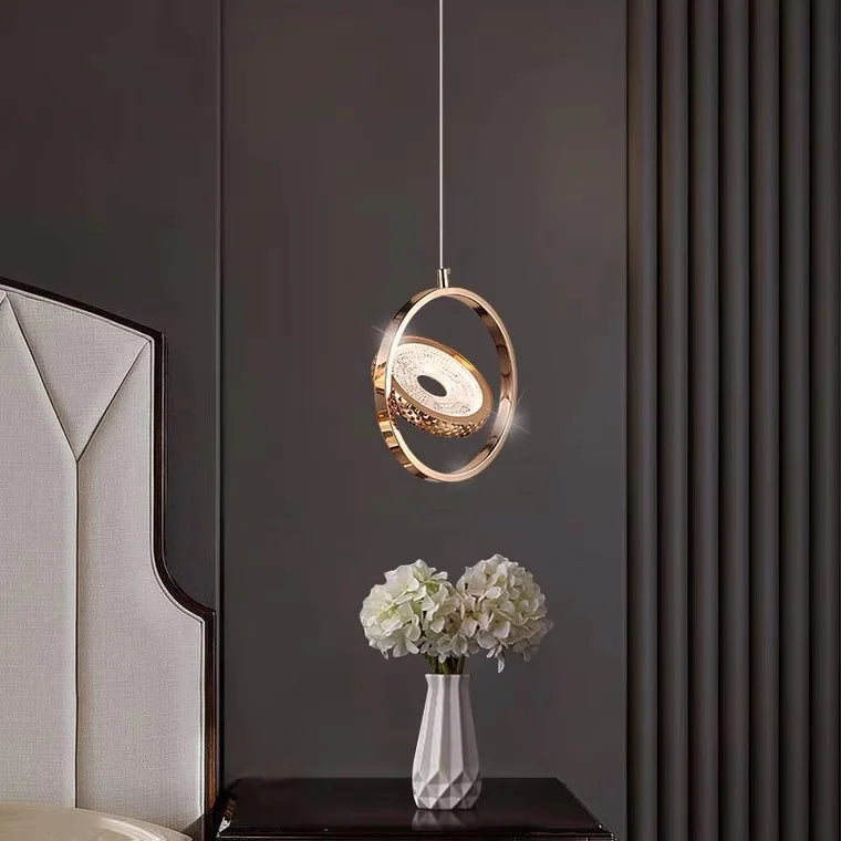 Modern crystal chandelier with gold accents, elegant design featuring cascading crystals and metallic finishes.