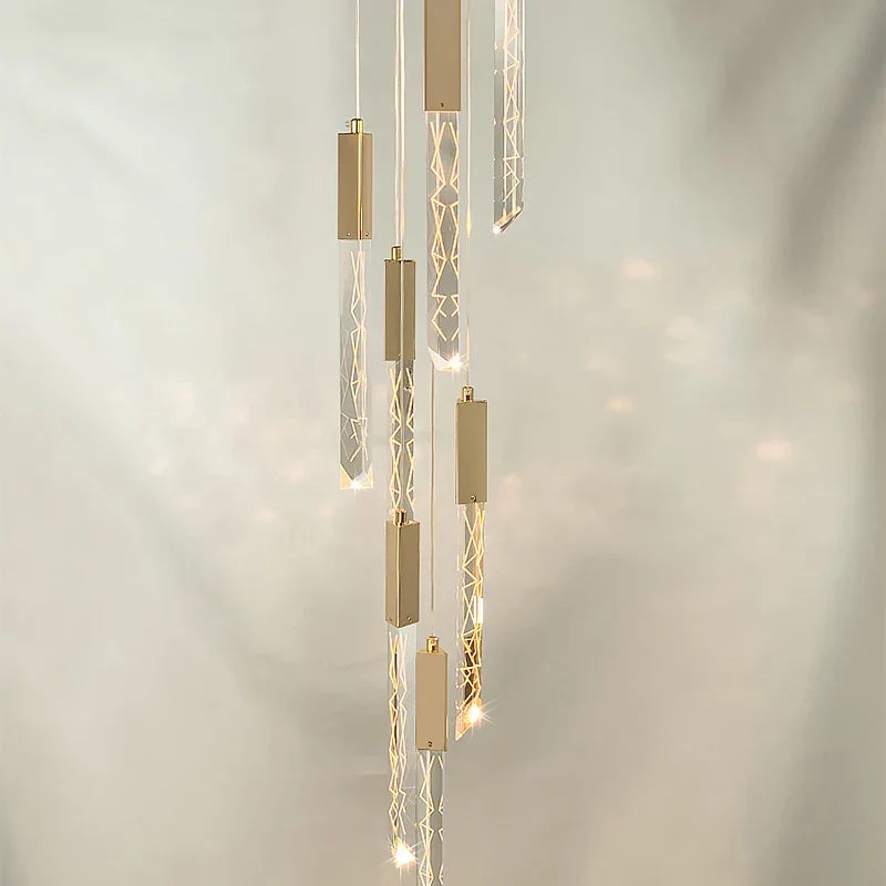 Maison Ornate Spiral LED Crystal Chandelier with illuminated glass and gold rectangular pendants.