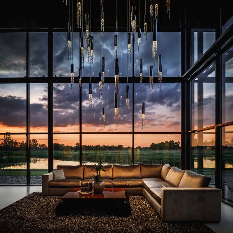 Maison Ornate Modern Elegant Crystal Chandelier sparkles overhead, featuring intricate crystal details and a contemporary design.