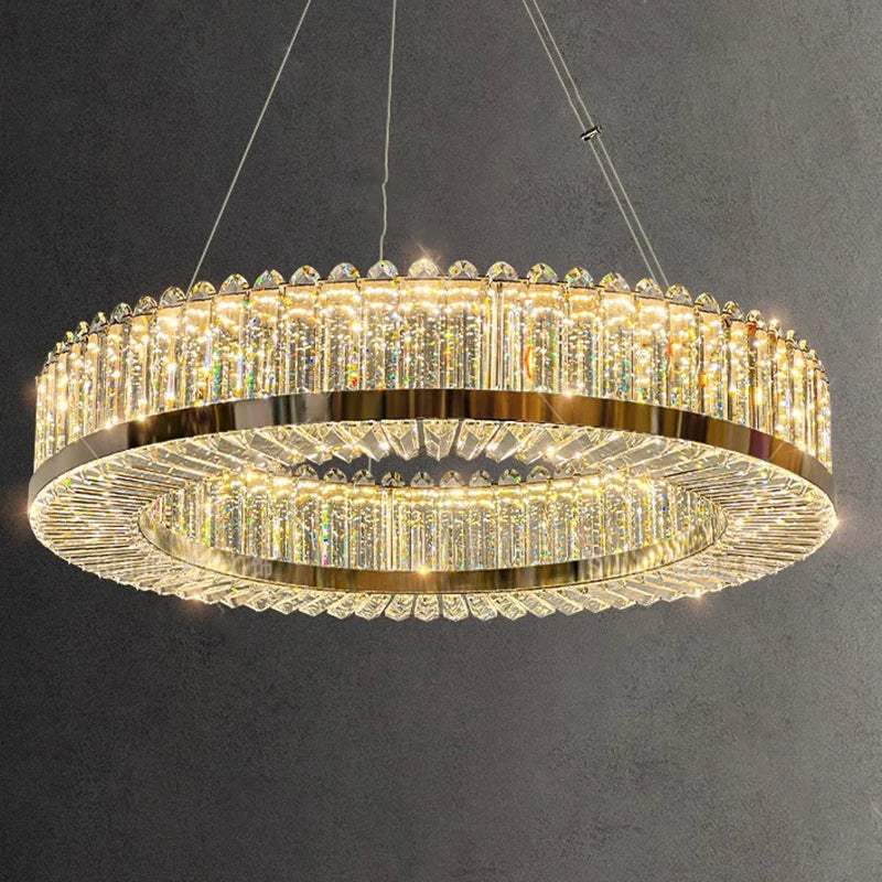 Geometric crystal chandelier with gold accents, slim suspension wires, and bright LED illumination.