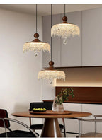 Three ornate French medieval-style crystal teardrop chandeliers with intricate metalwork and sparkling crystals.