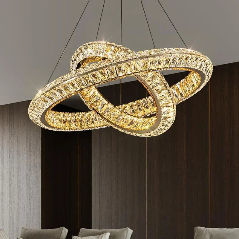 Two intertwined crystal LED rings form a modern, luxurious chandelier with radiant illumination.
