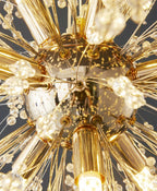 Maison Ornate Modern LED chandelier with gold base and acrylic rods tipped with crystal accents.