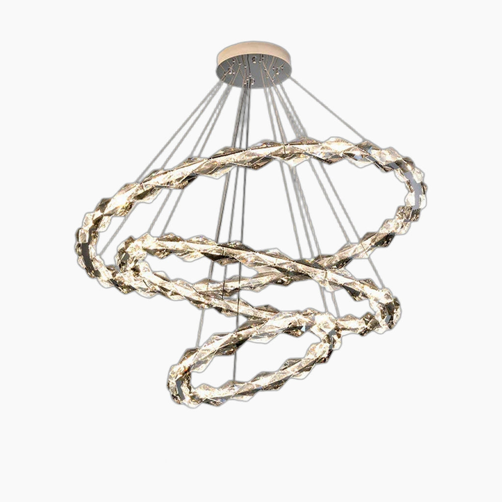 Three intertwined LED crystal rings with metallic finish, suspended by thin wires from round base.