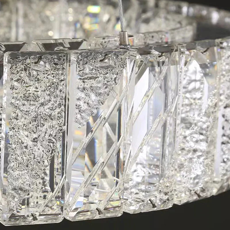 Close-up of Ornate Crystal Glass Pendant chandelier with textured, smooth vertical rectangular crystal panels.