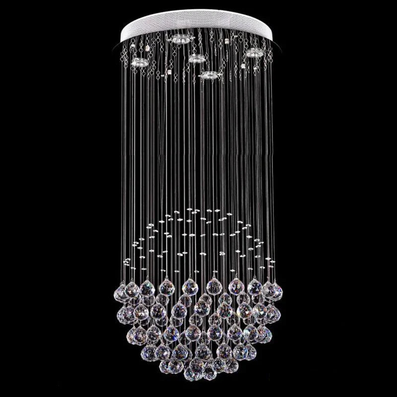 Modern spherical chandelier with polished steel, LED lights, and cascading clear faceted crystal spheres.